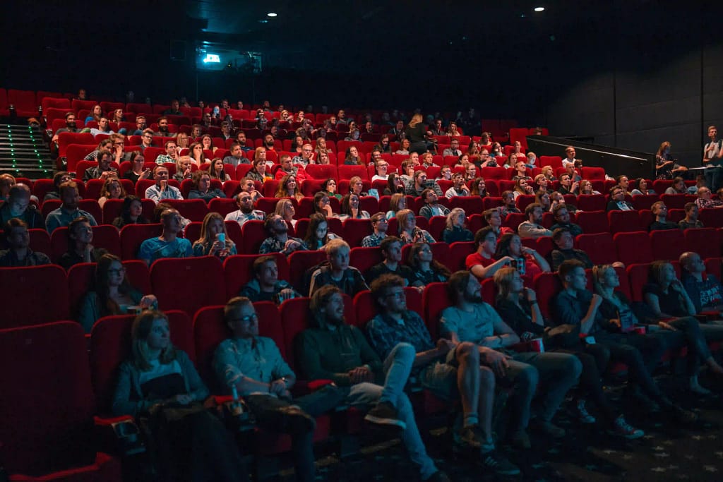 People watching a movie in a theatre 