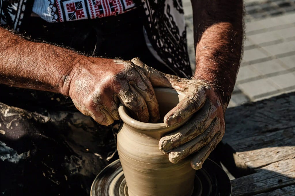 Skilled artisan making pottery 