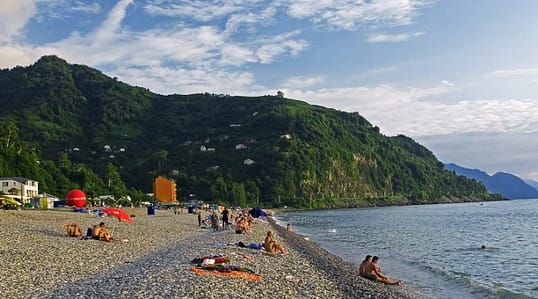 people lying by the sea in one of the top places to visit in Zugdidi, Georgia