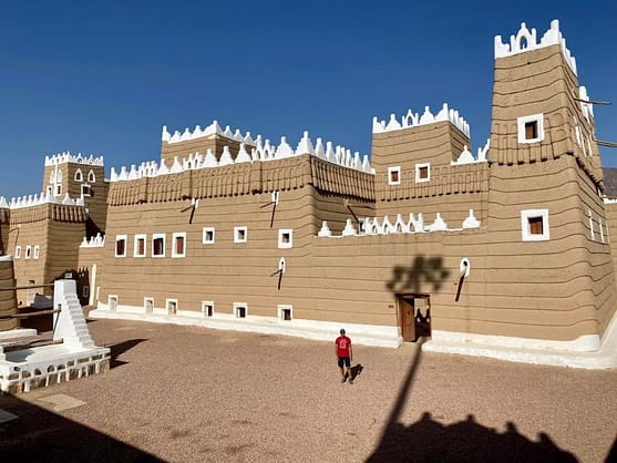 brown and white building in daytime in places to visit in Najran, Saudi Arabia