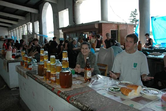 people in a market in one of the top places to visit in Zugdidi, Georgia