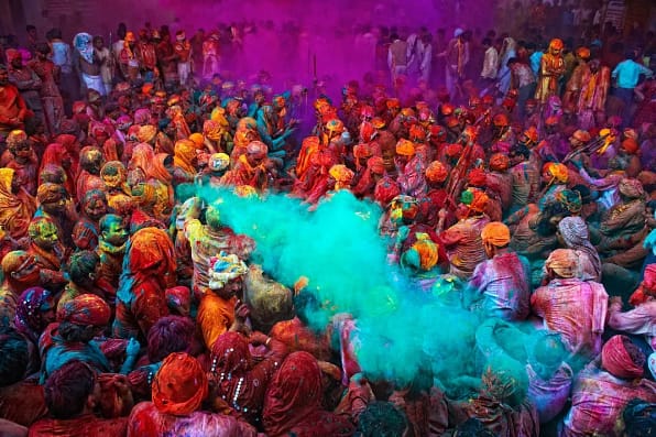 A group of people painted in different colours