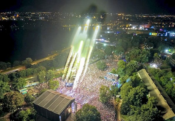 An aerial view of a party with fireworks and bright lights