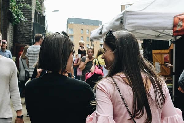 Two ladies talking on the street