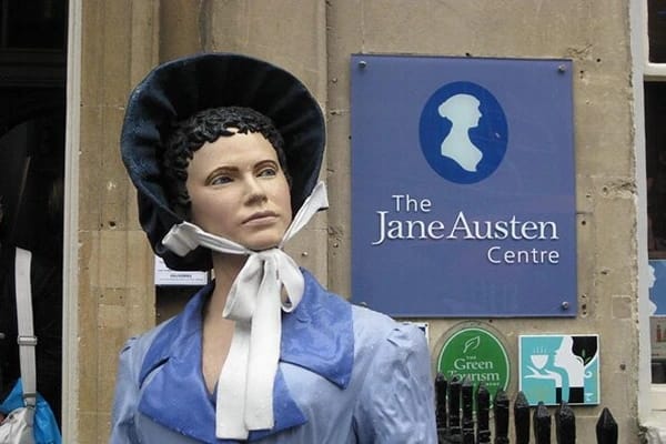 A sculpture of Jane Austen in front of the Jane Austen Center in Bath.