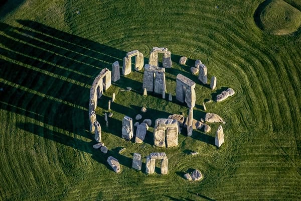 Aerial view of the Stonehenge monument with rocks arranged in a circular pattern. 