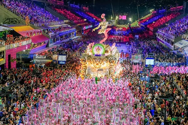 A festival with many people in colourful costumes and different lights