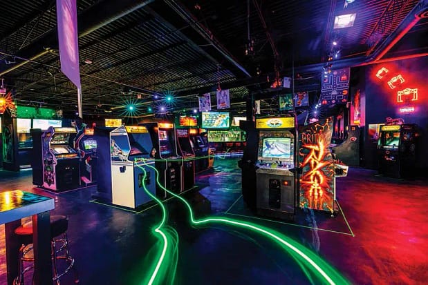 A large room with multiple video game machines