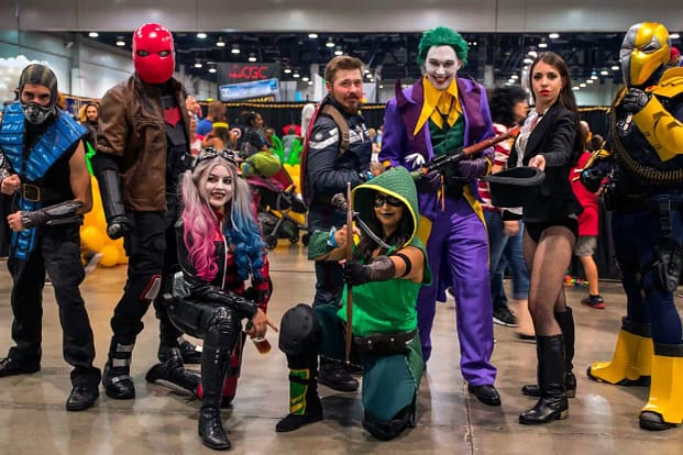 A group of people wearing different movie characters costumes 