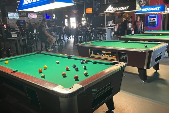 Pool tables in a bar. 