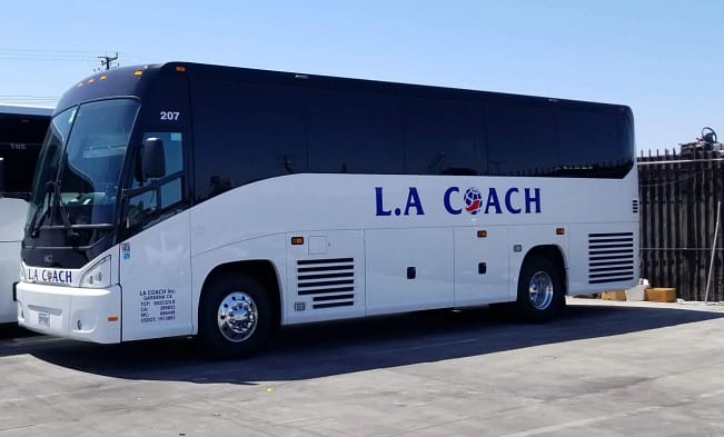 A white La Coach Inc Bus