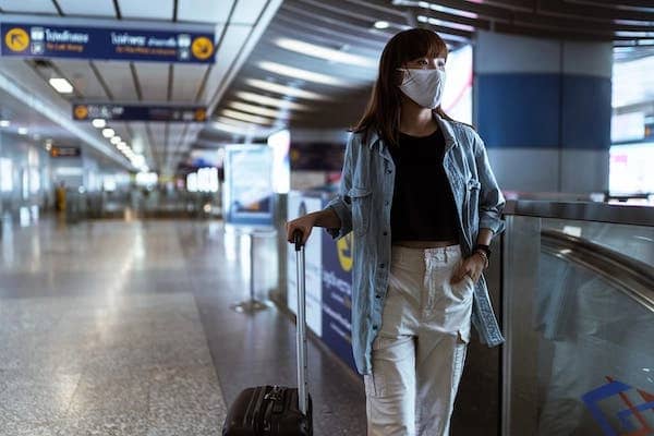A woman traveling alone at the airport
