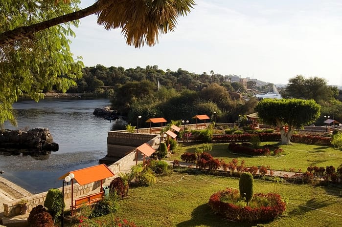 Aswan Botanical Garden, Egypt. A large area of land with different flowers, separated from a river