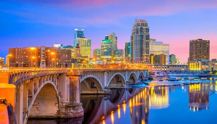 The Old Bridge of  Minneapolis, Minnesota  with colourful lights around the bridge and in the surrounding city