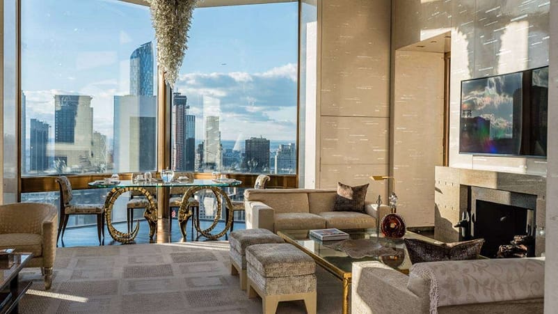 TY Warner Penthouse - Four Seasons - $60,000A large luxury hotel room with glass windows facing the city