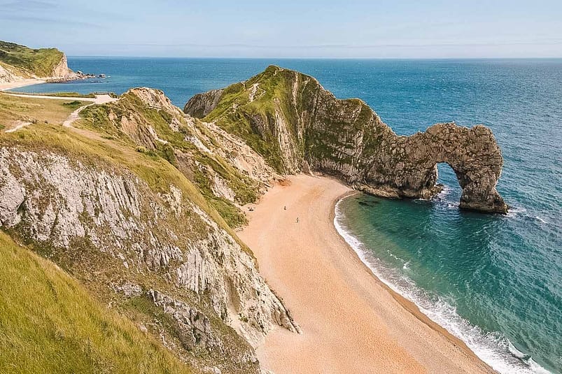 Large high lands surrounding a beach, Durdle Door, England